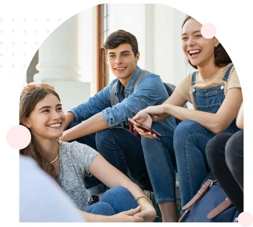 Group of smiling students chatting on steps