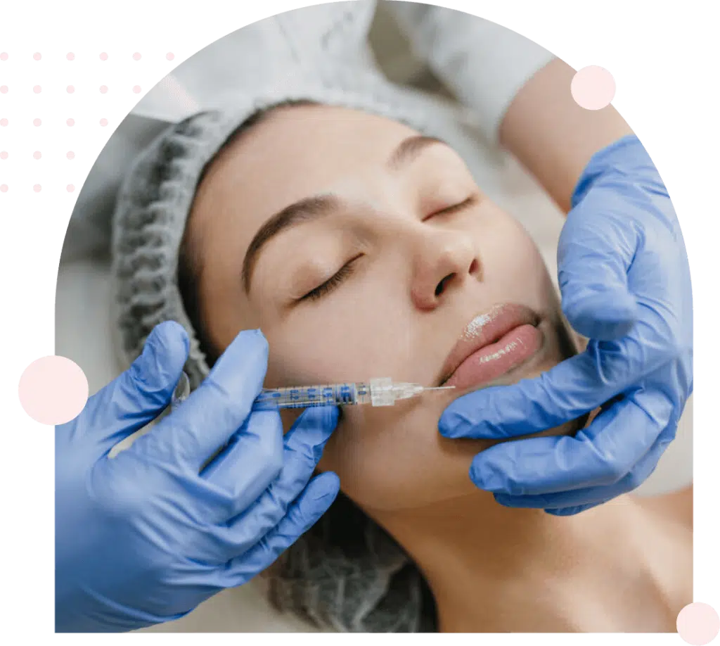 Woman receiving cosmetic lip filler injection